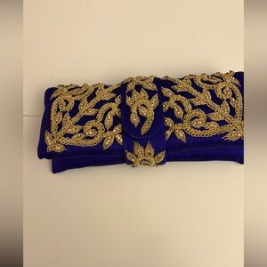 Purple clutch with Gold embellishment